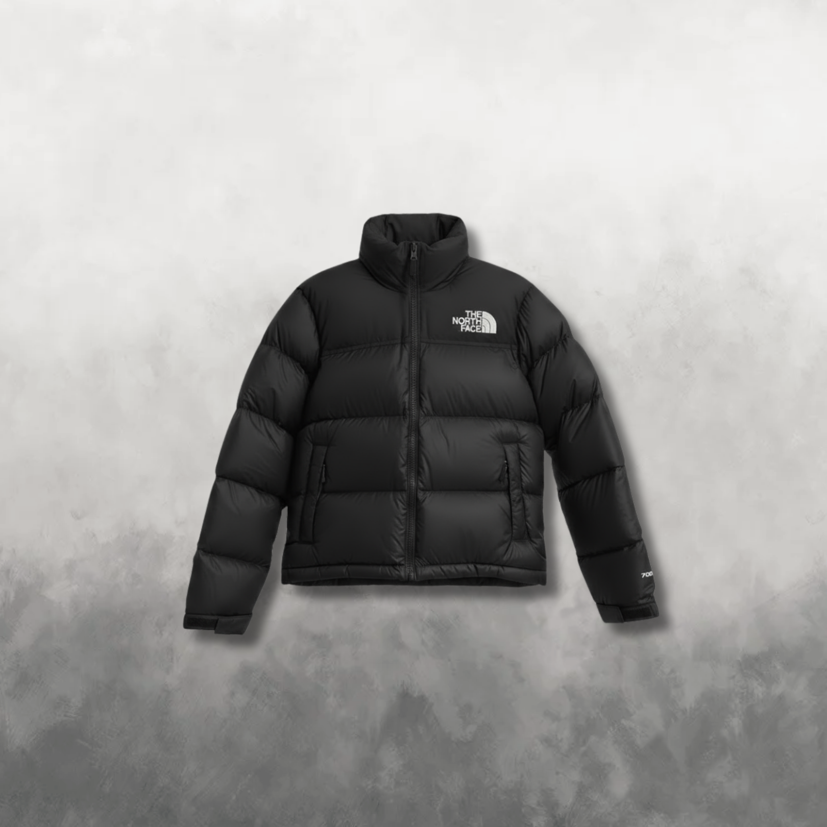 Black puffer jacket with brand logo on a gray background