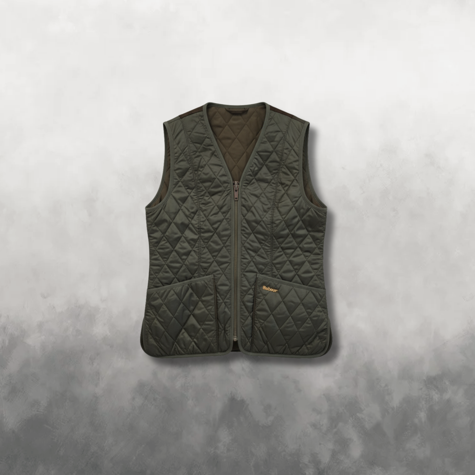 Dark green quilted vest on a gray background