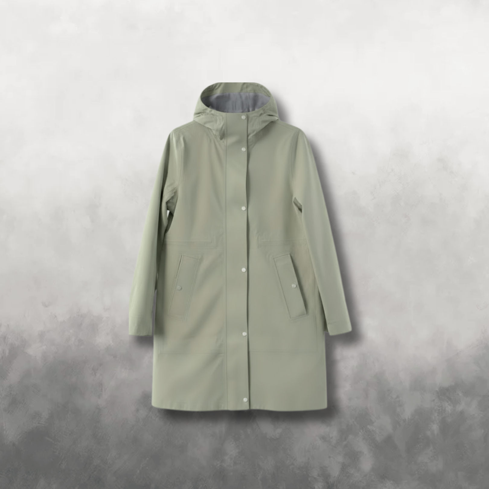 Green raincoat on a gray background