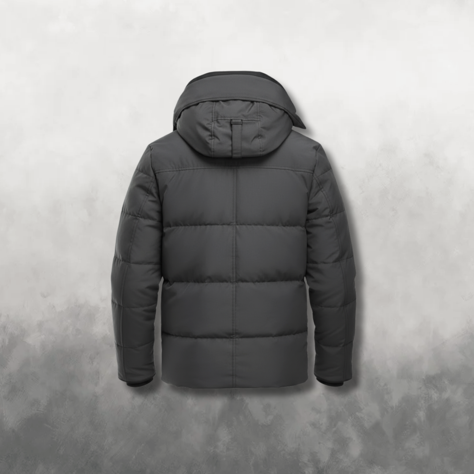 Back view of a dark gray puffer jacket on a textured gray background