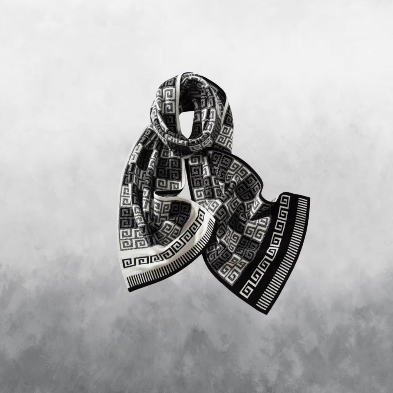 Black and white patterned scarf on a textured gray background