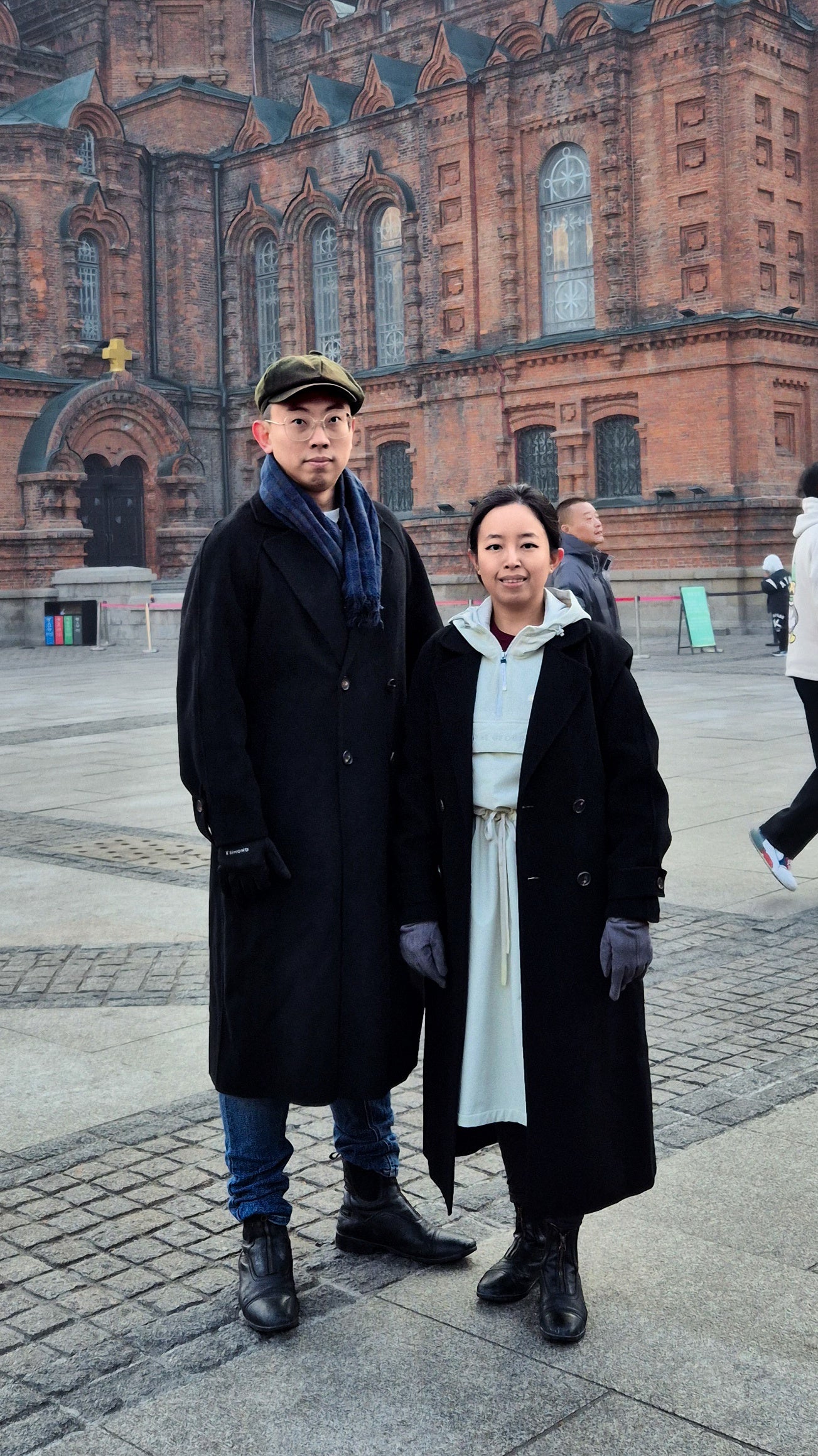 A couple at St Sophia Cathedral, Harbin, wearing Goelia Cashmere & Wool Wrap Coat, Black, Temp about -4°C