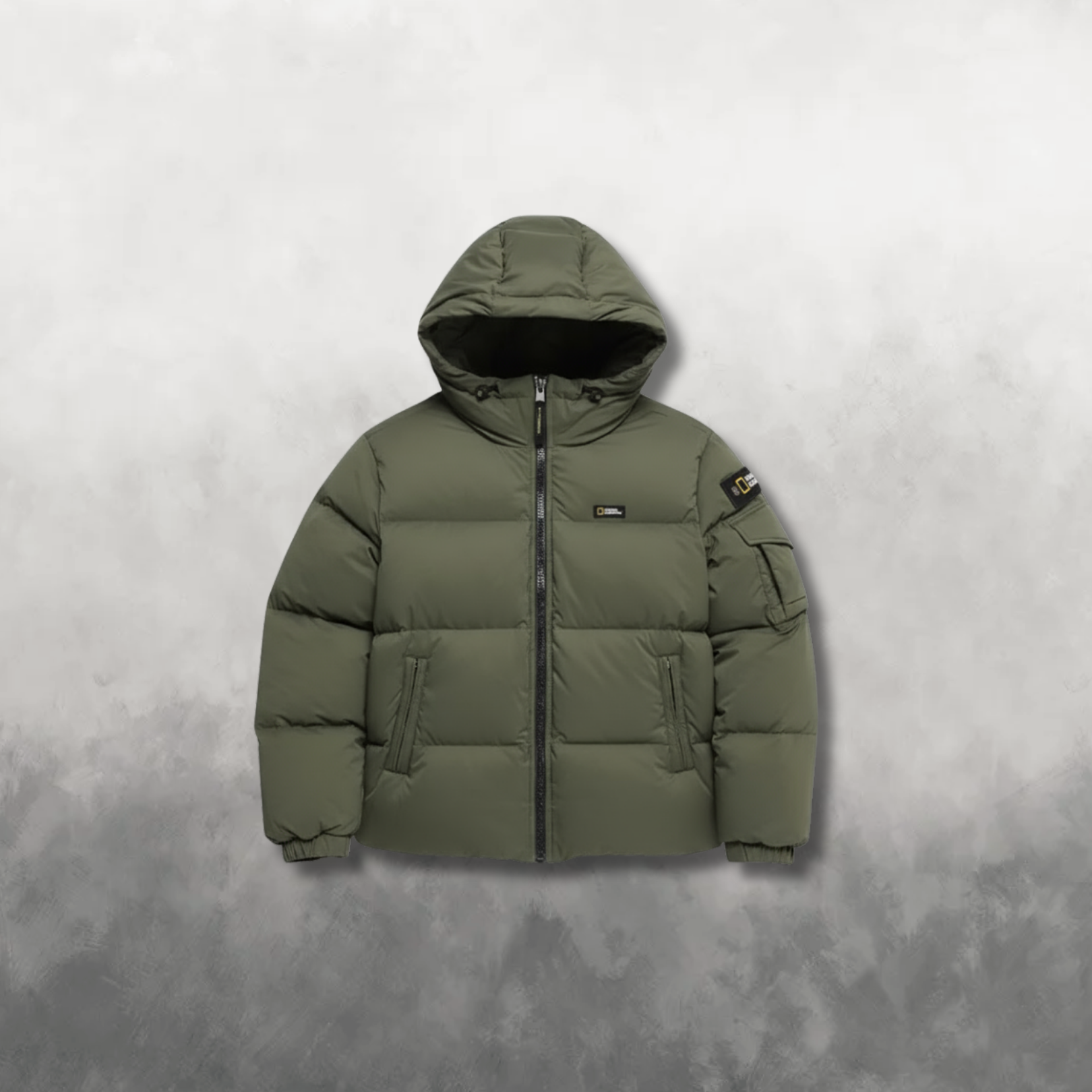 Green puffer jacket on a textured gray background