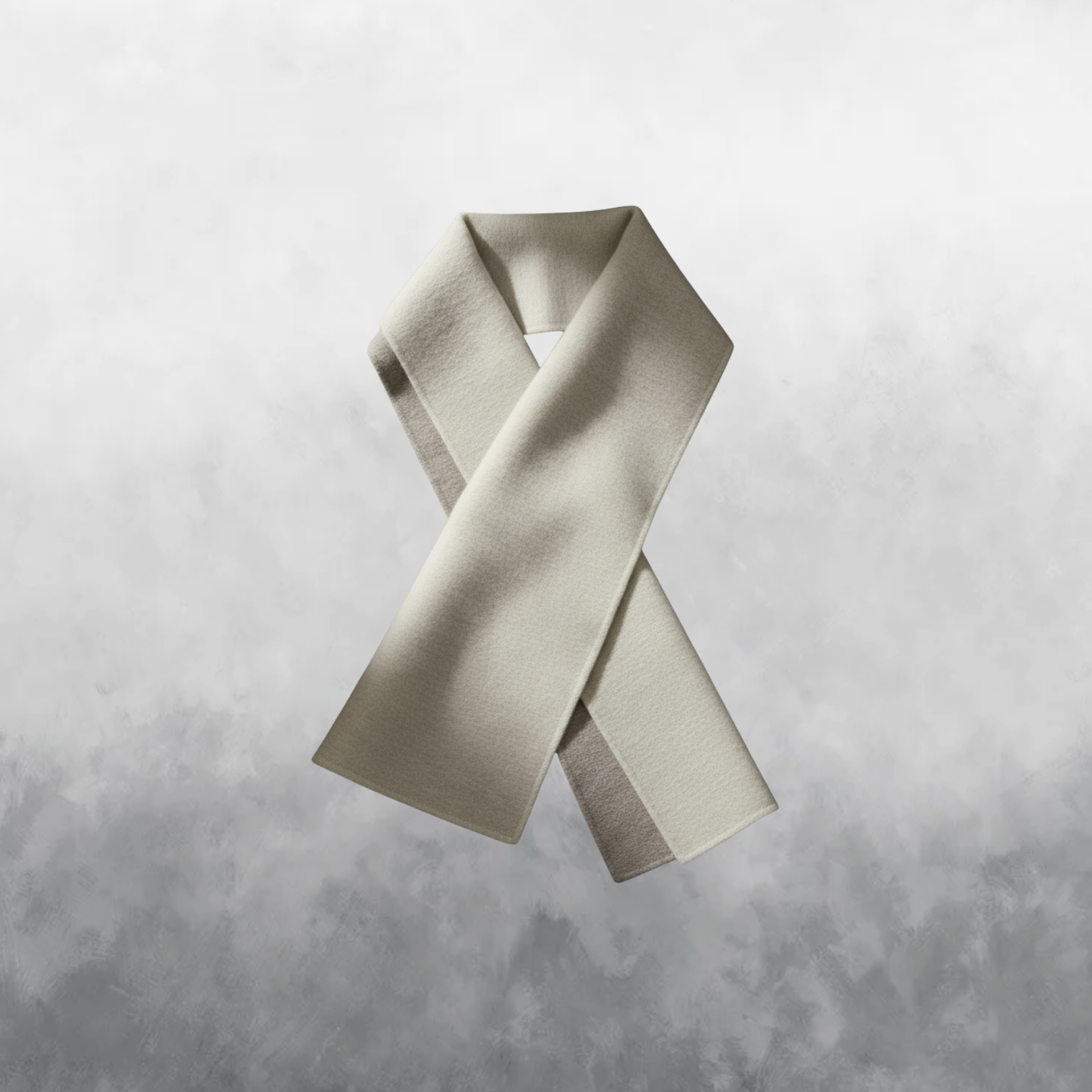 Beige scarf on a textured gray background